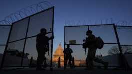 National Guard soldiers open a gate