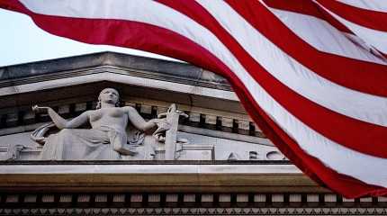 American flag flies outside the Department of Justice in Washington