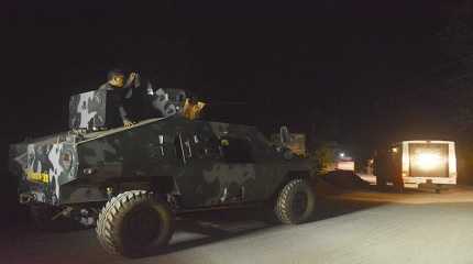 Philippine marines escort a police van