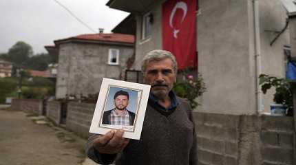 Recep Ayvaz shows a picture of his son, Selcuk Ayvaz