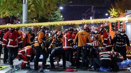 Rescue workers work on the scene of a crushing accident