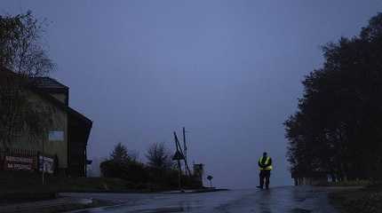 police officer stands at a checkpoint