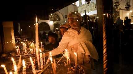 Ethiopian woman and her child visit the Church