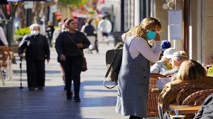 People are seen on a street in Burlingame