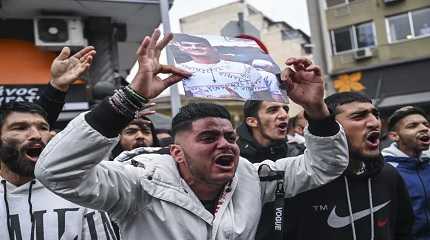 Relatives and other protesters from the Roma community