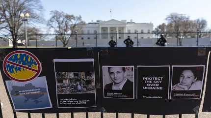 Signs and pictures of those killed  including journalist Brent Renaud