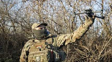 Ukrainian serviceman flies a drone