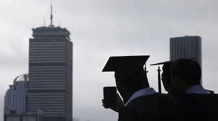 graduating student records the academic procession