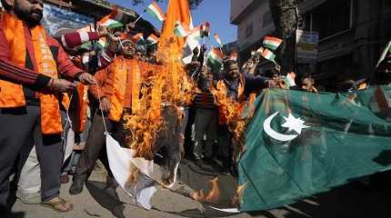 Rajouri district of Indian-controlled Kashmir burn Pakistan flag during a protest in Jammu