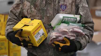 Utah Food Bank volunteer carries groceries