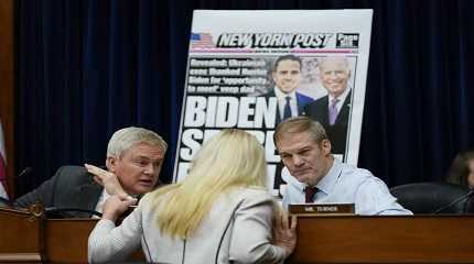 Marjorie Taylor Greene talks with James Comer and Chair Jim Jordan