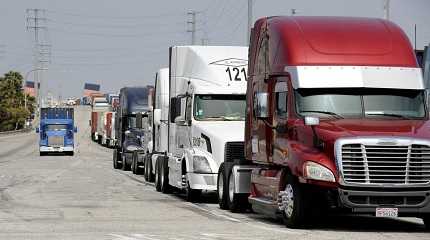 Semi-trucks line up near Pier J 