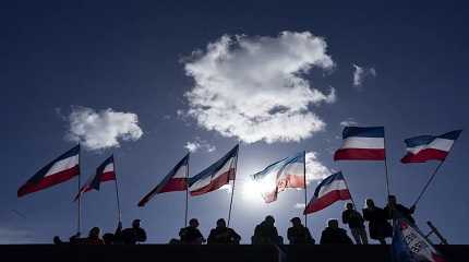 Netherlands flags fly in protest