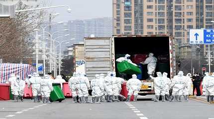 Workers in protective suits