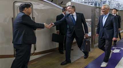 Antony Blinken and Rahm Emanuel is greeted by Yoshimasa Hayashi