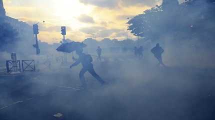 Youths move on the street during a demonstration