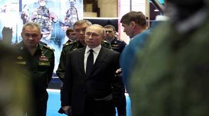 Vladimir Putin,  Sergei Shoigu and Valery Gerasimov attend an exhibition of military equipment