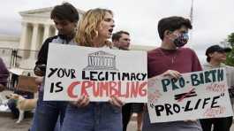 Demonstrators protest outside of the U.S. Supreme Court