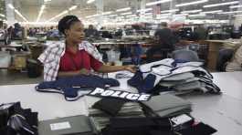 Laurette Eugene assembles a body armor vest