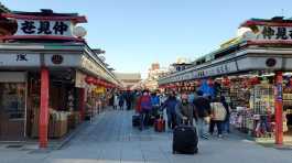 Tourists wearing protective face masks