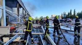 Rescuers work at a site of a shopping mall hit by a Russian missile strike