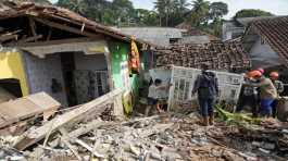 Rescuers help clear up debris