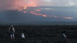 Spectators watch the lava