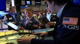 Traders work on the floor of the New York Stock Exchange