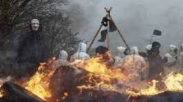 Protesters burning barricade