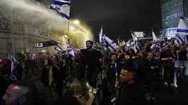 Israeli police use a water cannon to disperse demonstrators