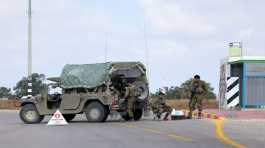 Israeli soldiers block a road