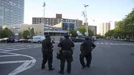 new york city police officers stand outside the riverdale jewish center